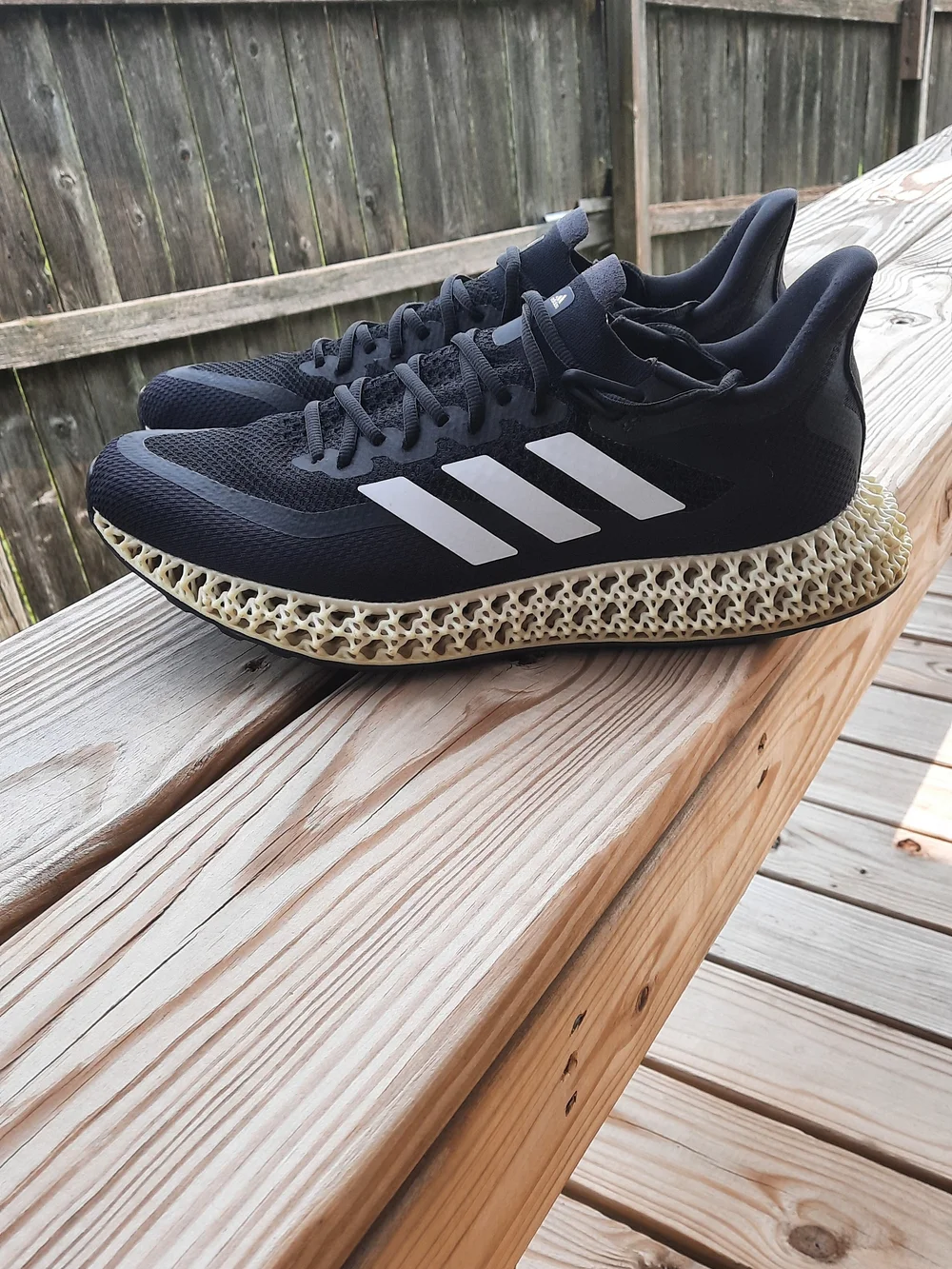 adidas Men’s Black Athletic Shoes with White Stripes and Cream 4D Midsole